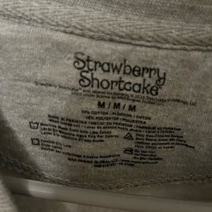 Women’s Strawberry Shortcake sweatshirt. Size medium. Gray color.
